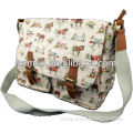 Coated all over print canvas cross body bag